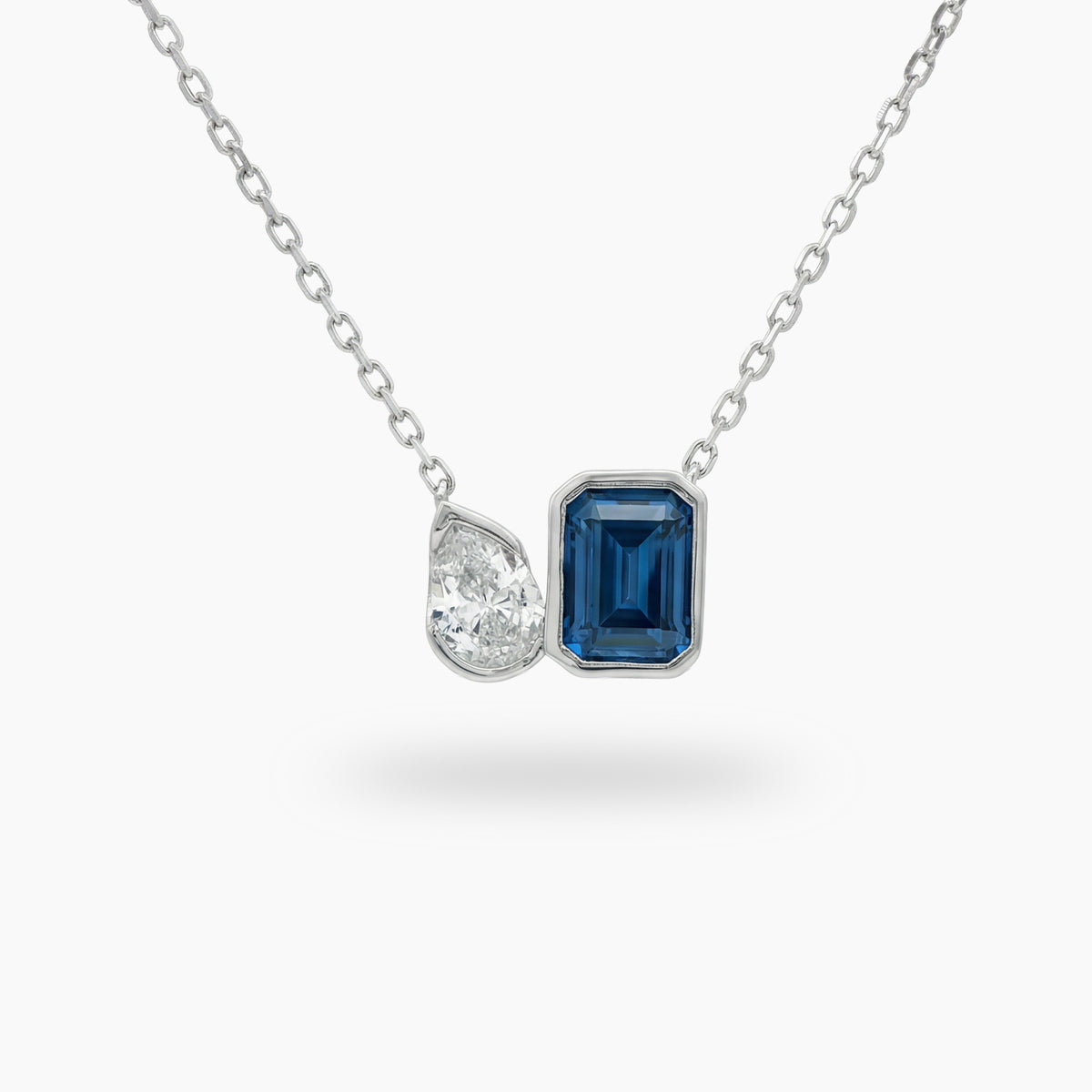 Duality Necklace with Blue Emerald Stone – on White Gold