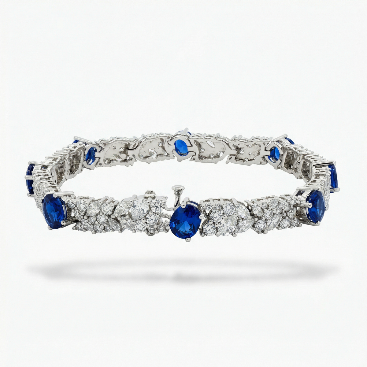 White Gold Tennis Bracelet with Deep Blue Oval Sapphires