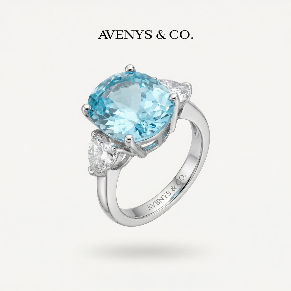 Oval Trilogy Pear Ring with Blue Oval Stone – on White Gold