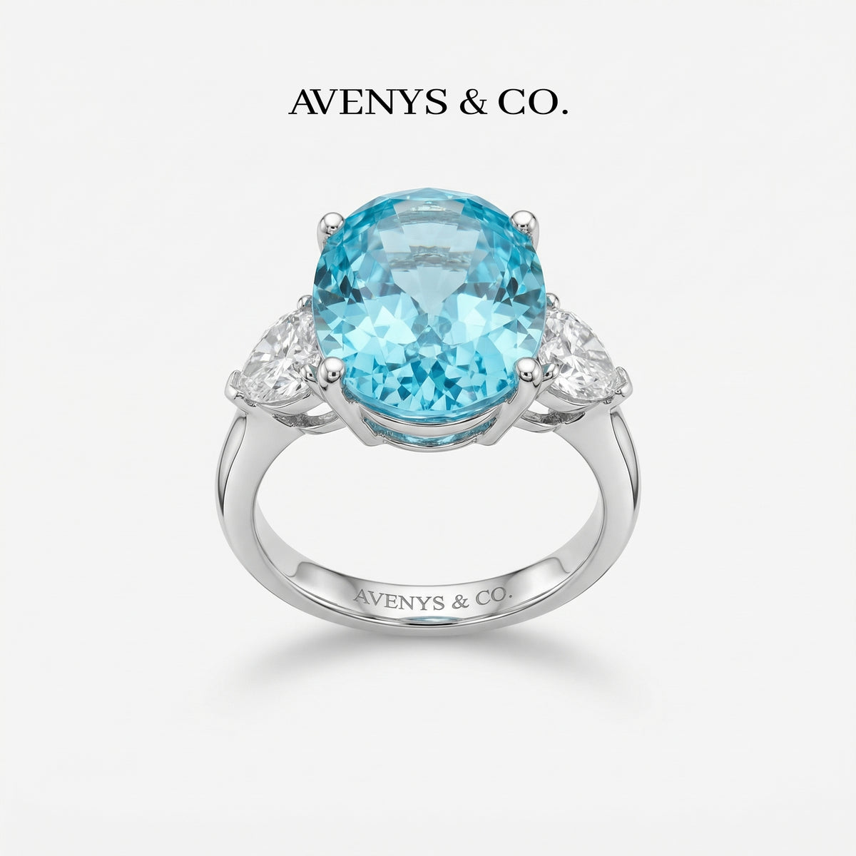 Oval Trilogy Pear Ring with Blue Oval Stone – on White Gold