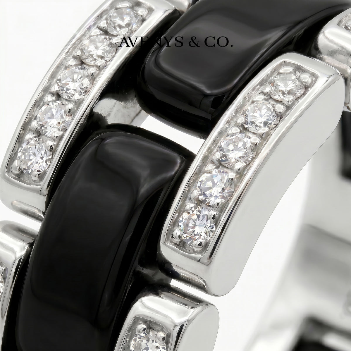 Connected Ring with Black Round Stone – on White Gold