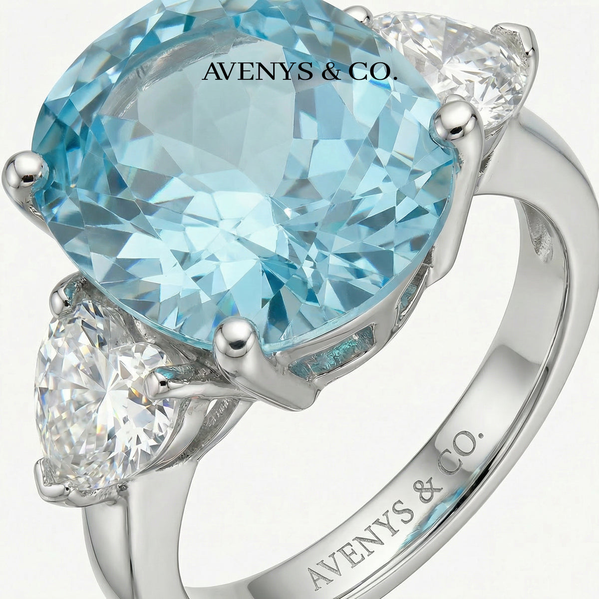 Oval Trilogy Pear Ring with Blue Oval Stone – on White Gold
