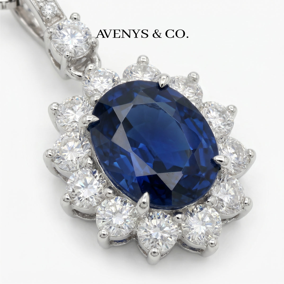 Classic Halo Necklace with Blue Oval Stone – on White Gold