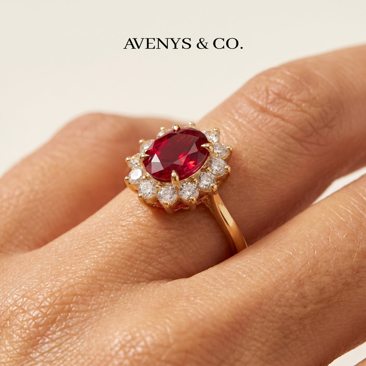 Classic Halo Ring with Red Oval Stone – on Yellow Gold