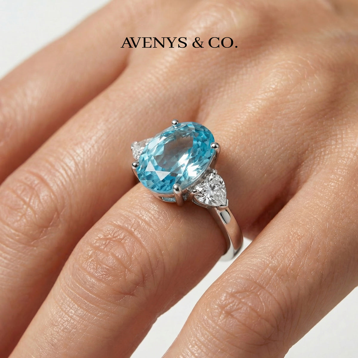 Oval Trilogy Pear Ring with Blue Oval Stone – on White Gold