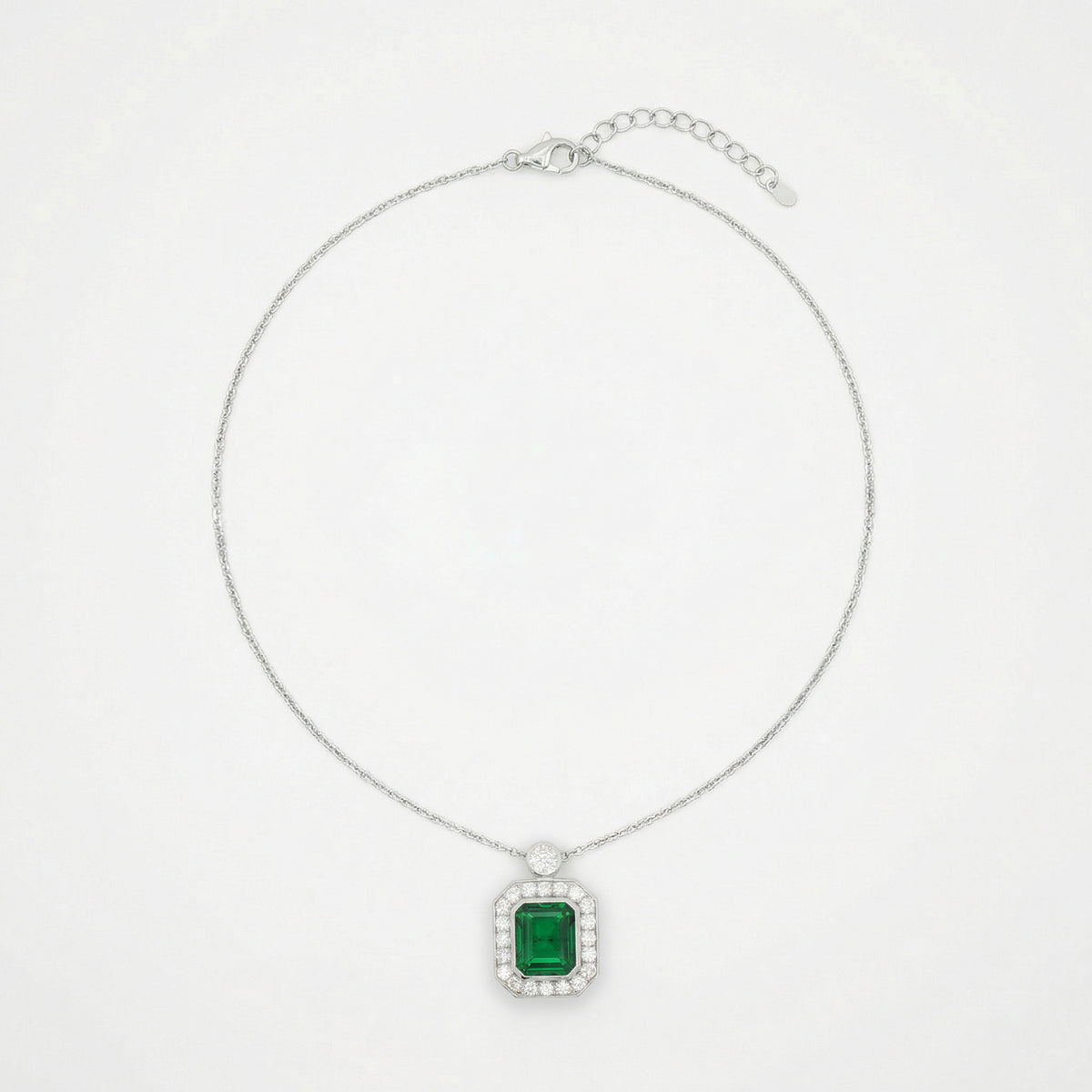 Emerald and Diamond Charm Necklace in White Gold Plated Silver
