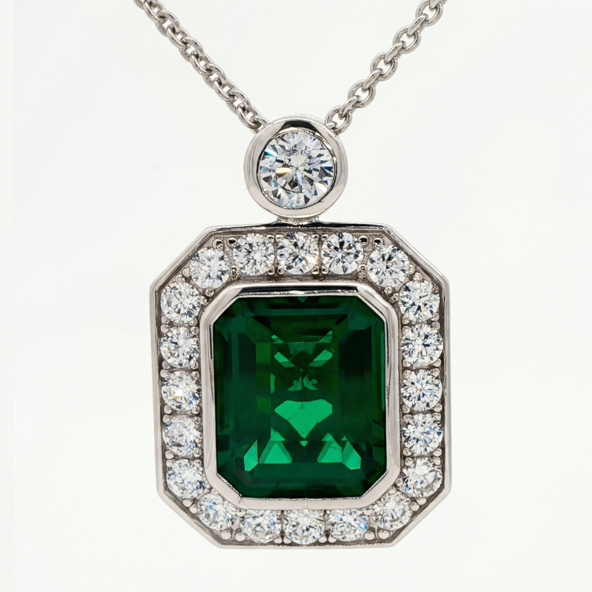 Emerald and Diamond Charm Necklace in White Gold Plated Silver