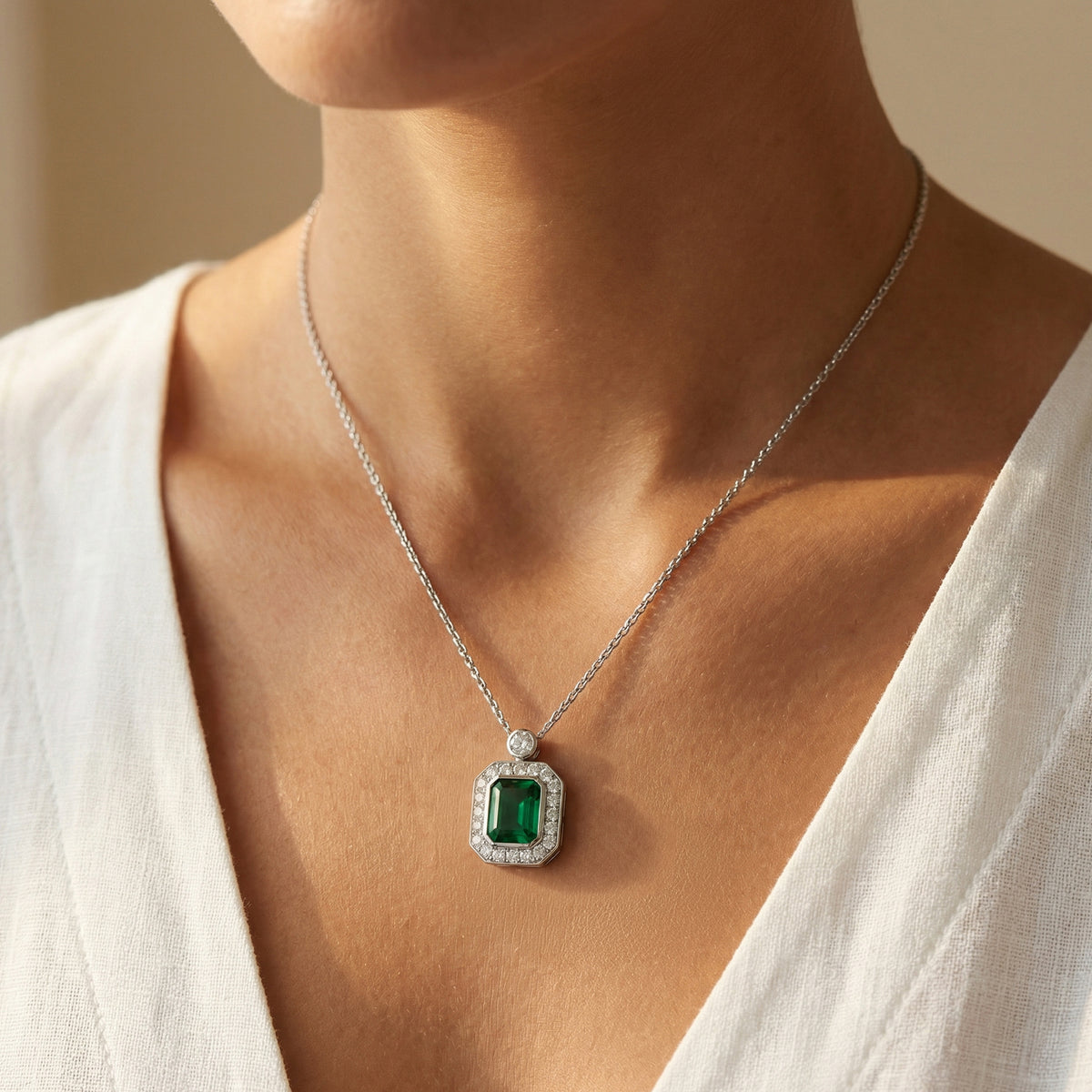 Emerald and Diamond Charm Necklace in White Gold Plated Silver