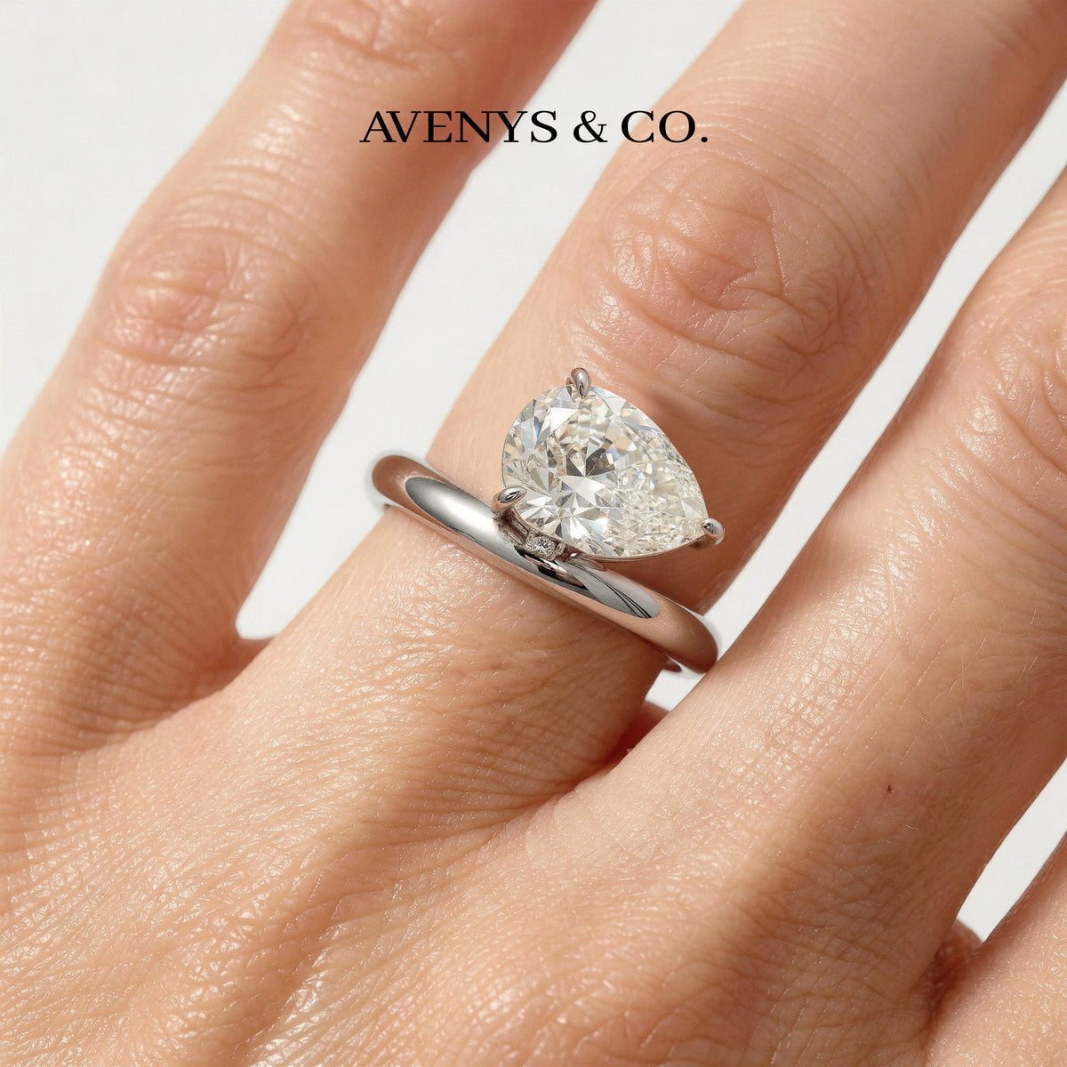 Wave Solitaire Ring with White Pear Stone – on White Gold