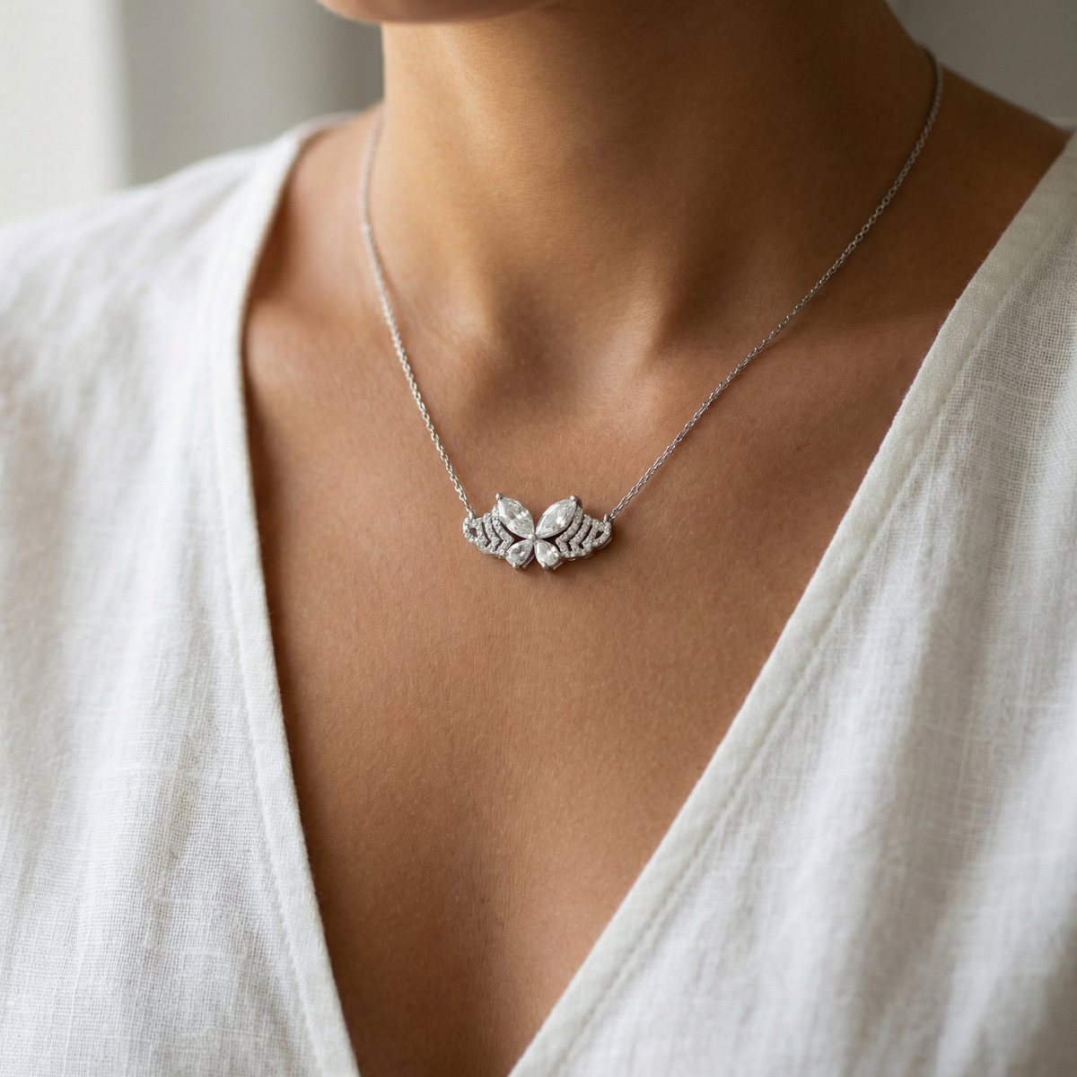 White Gold Plated Silver Butterfly Charm Necklace with Pear Cut Diamonds