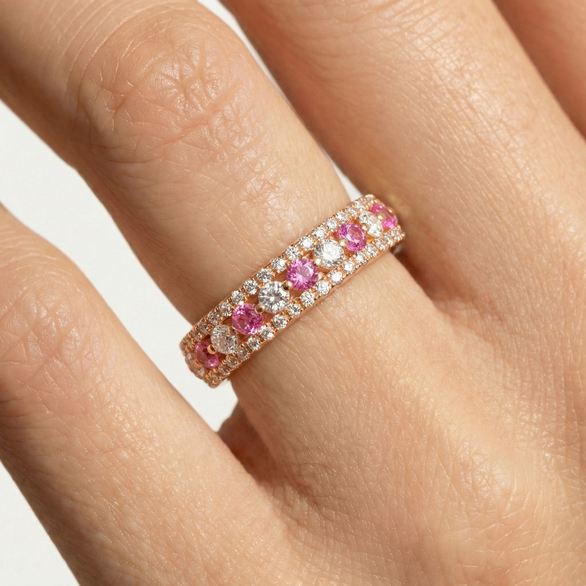 Rose Pave Band with Pink Round Stone – on Rose Gold — Additional close finger fit view