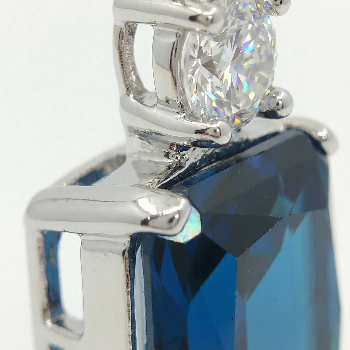 Radiant Pendant Necklace with Blue Radiant Stone – on White Gold — Side basket/bail macro not present in existing front macro