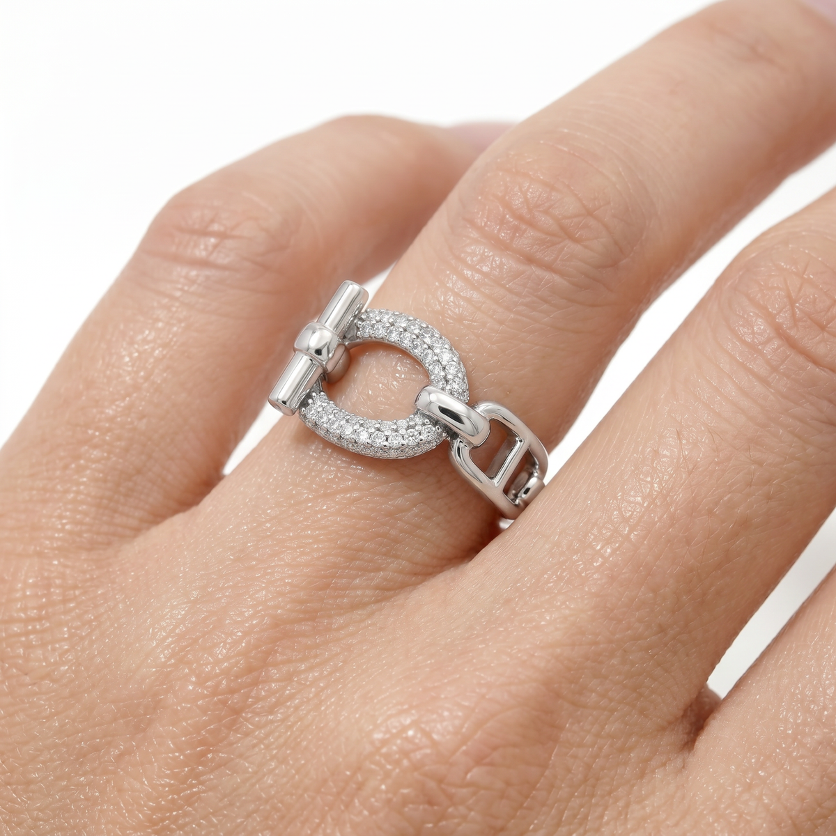 Buckle Pave Ring with White Round Stone – on White Gold — on hand