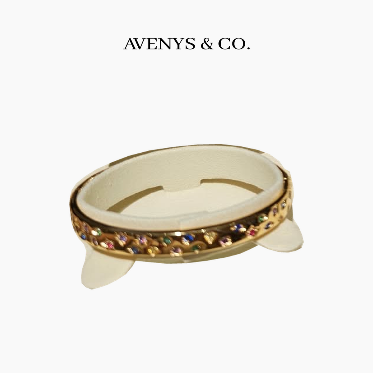 AVENYS & CO. Confetti Bangle in Yellow Gold with multicolour stones, 17cm, shown on a display holder. Cutout from the original product photograph.